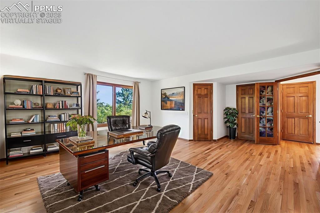 Image 22 of 50: virtually staged, main level bedroom/office