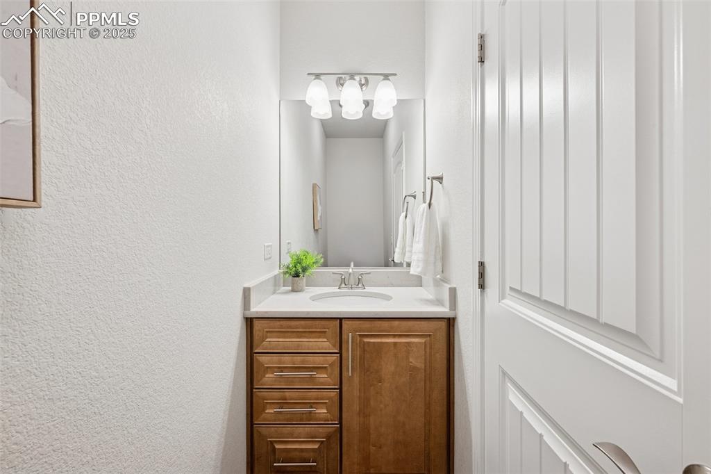 Image 11 of 50: Half bath on main near office and front door