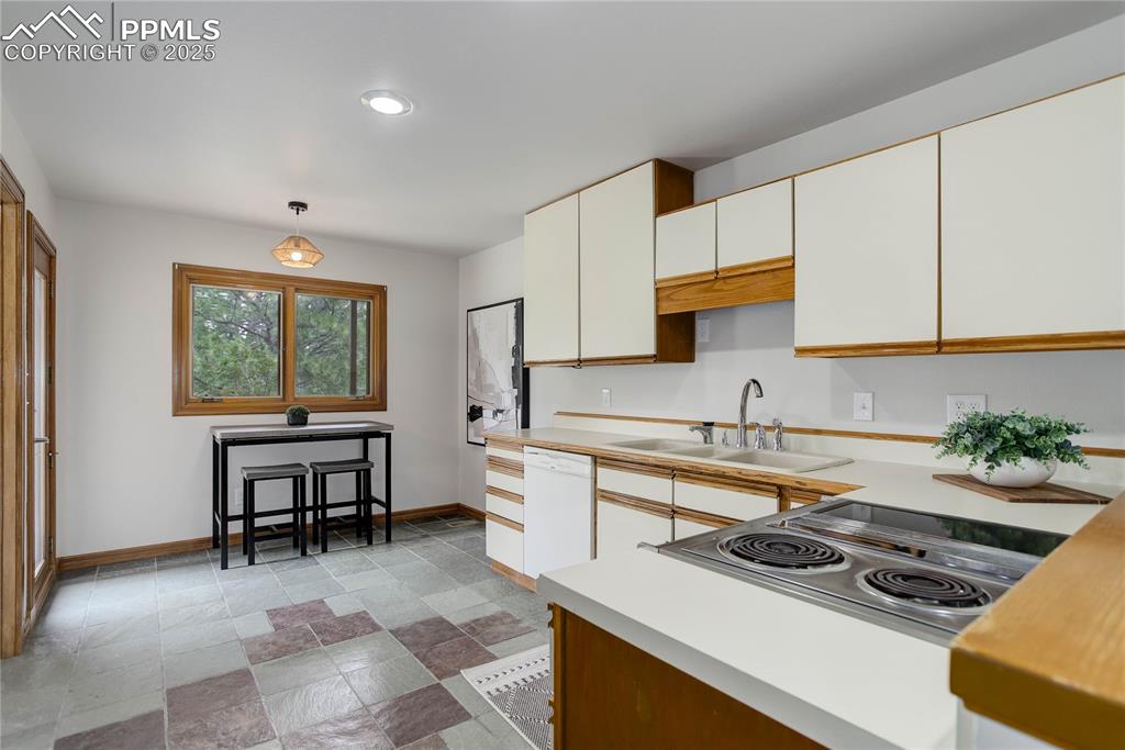 Image 11 of 33: Breakfast nook & walk-out to deck