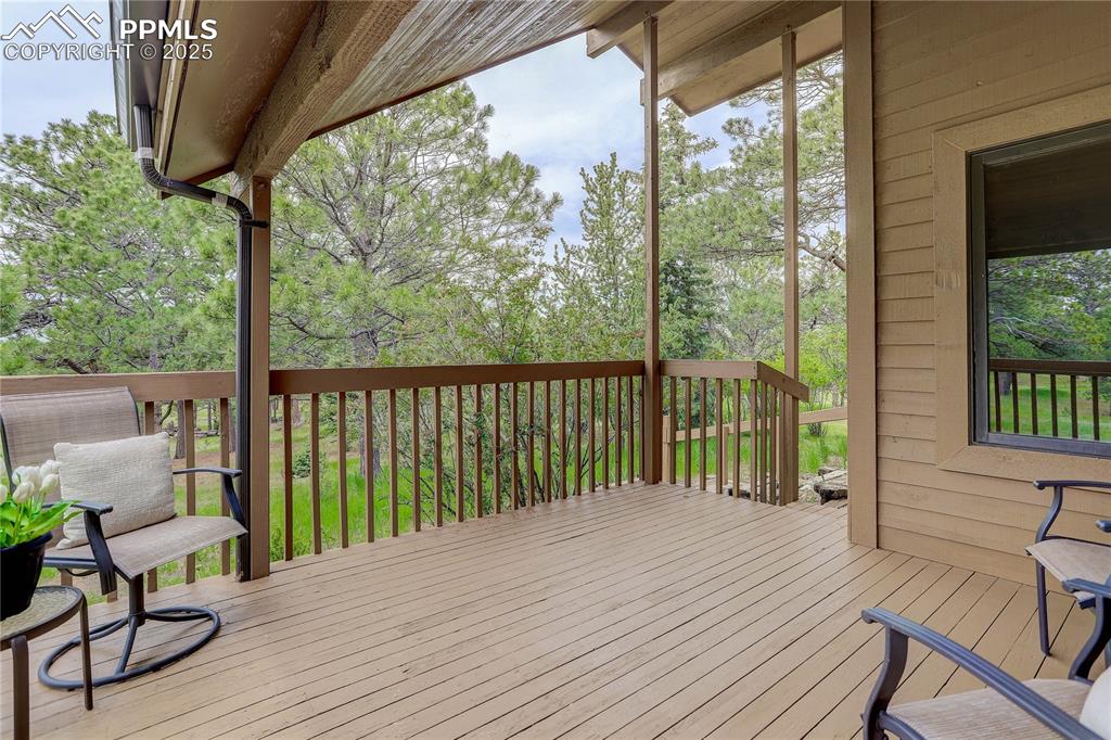 Image 12 of 33: Covered deck off of kitchen