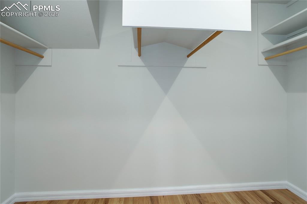 Image 16 of 33: Massive primary walk-in closet