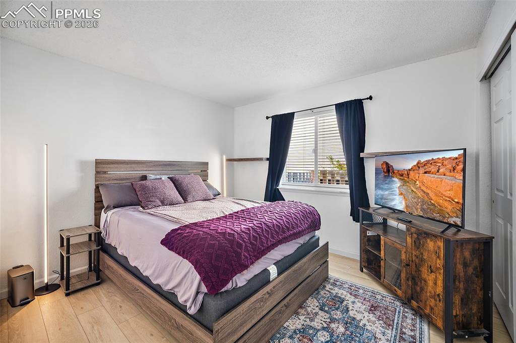 Image 21 of 46: Bedroom featuring wood-finish flooring