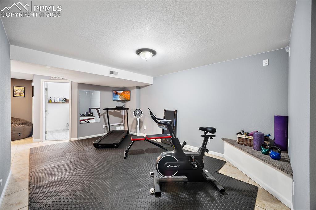 Image 23 of 46: Finished room featuring a ceiling-mounted light fixture, light gray walls, 