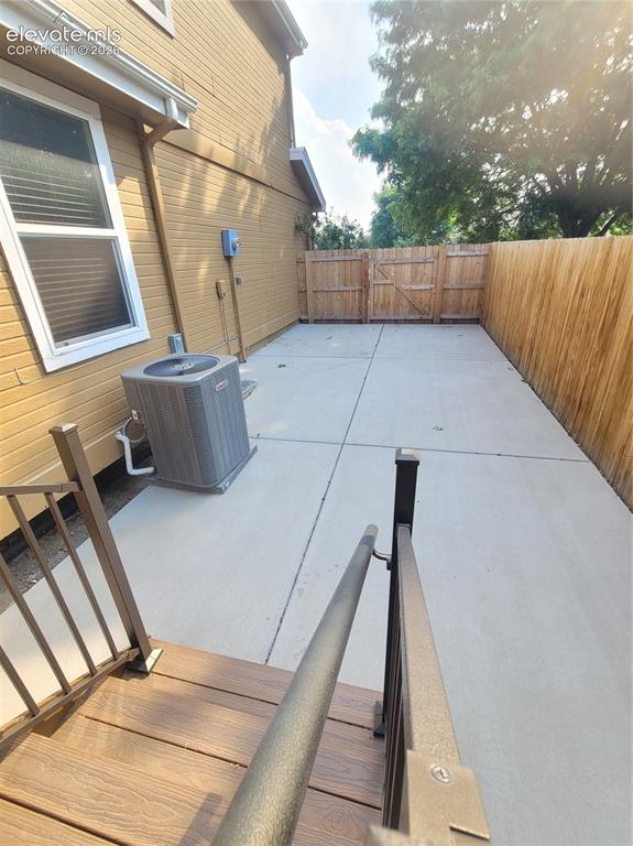 Image 21 of 22: concrete pad left side of house, in rear