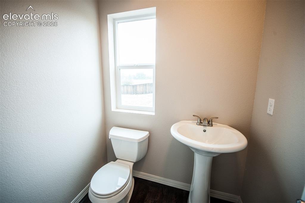 Image 10 of 29: Powder room on the main level