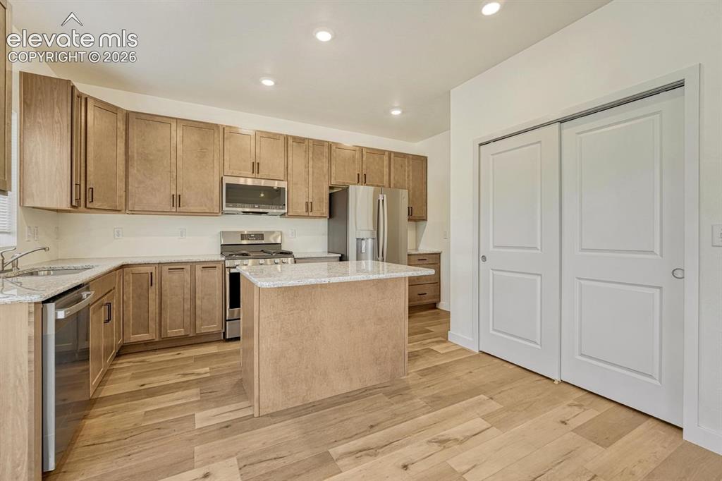 Image 11 of 50: Stainless steel appliance package includes gas range and refrigerator