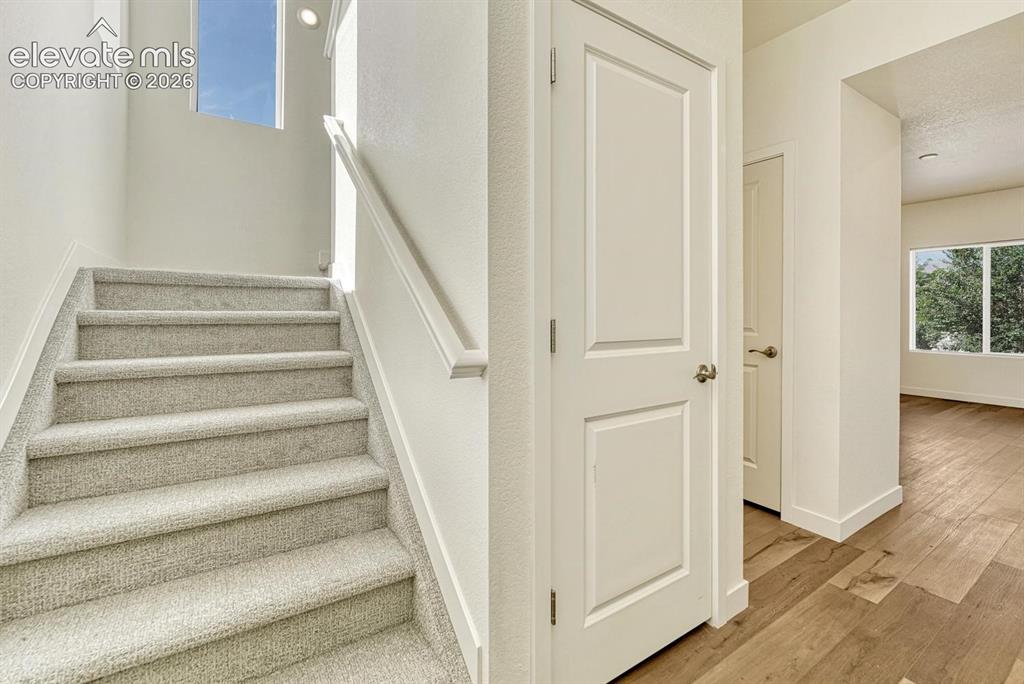 Image 16 of 50: Natural light fills the staircase