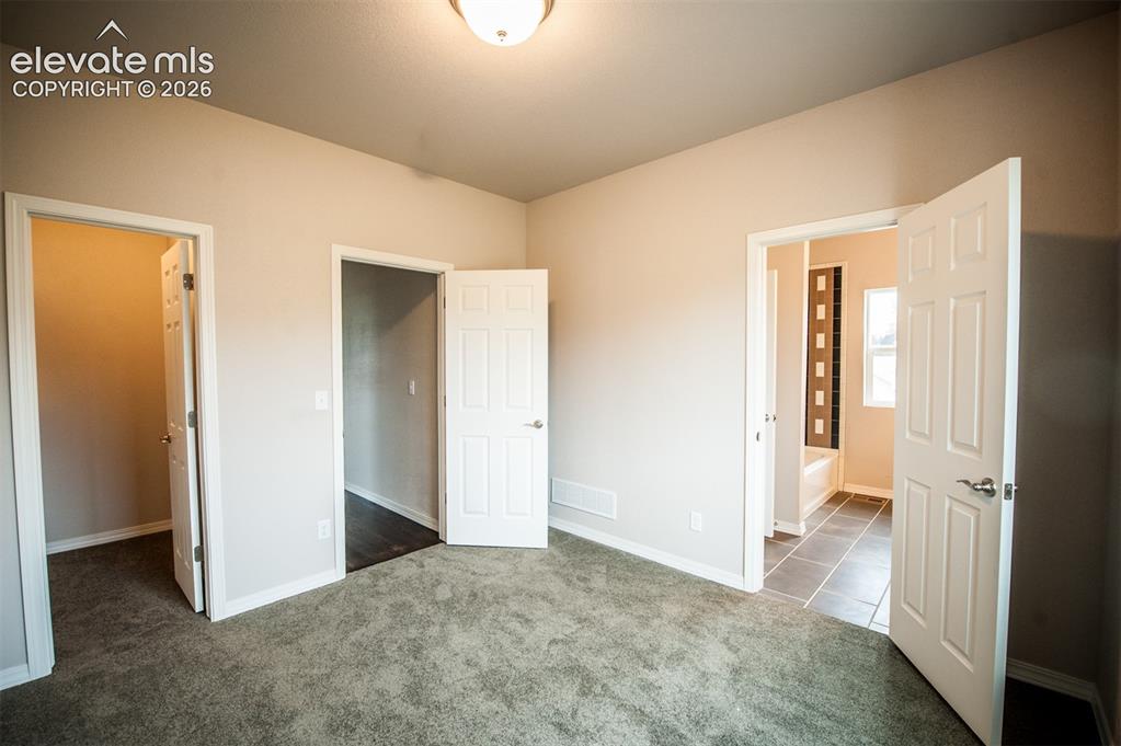 Image 19 of 29: Walk-in closet in 2nd bedroom