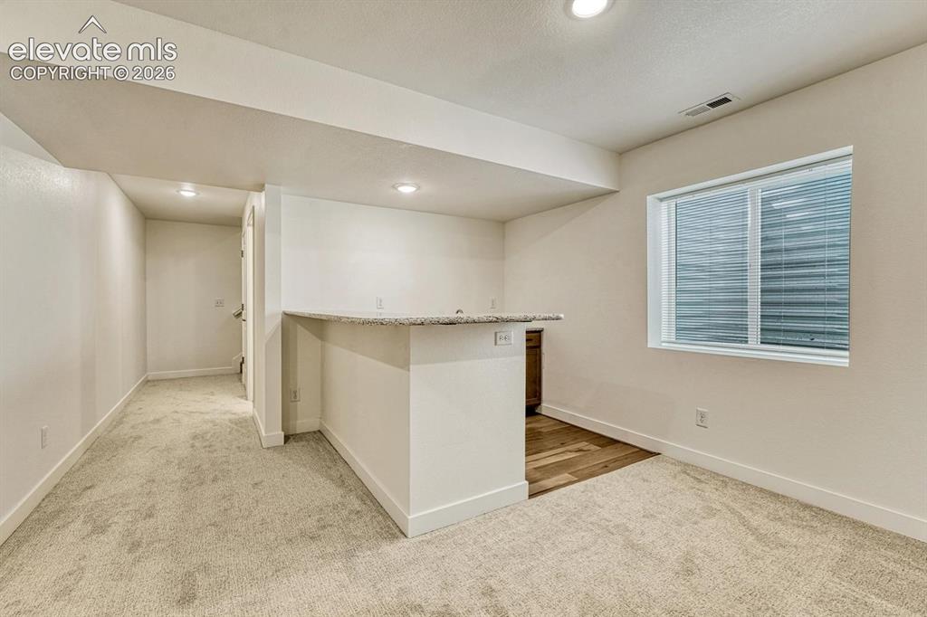 Image 37 of 50: Basement is pre-plumbed for a wet bar, which can be added (ask about pricin