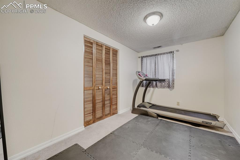 Image 17 of 30: Basement bedroom