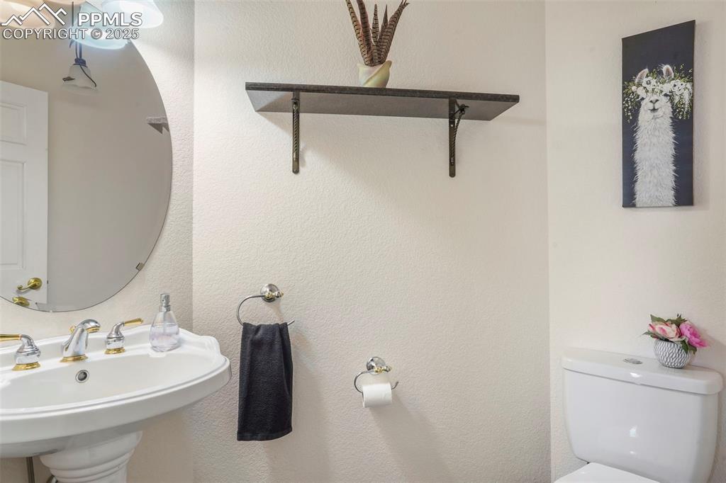 Image 18 of 50: Powder Room on main level.