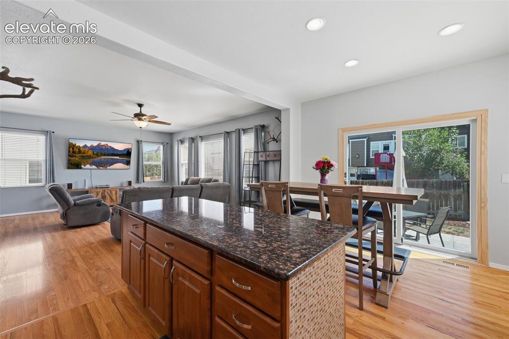 Image 16 of 35: Hardwood flooring, recessed lighting, and a ceiling fan