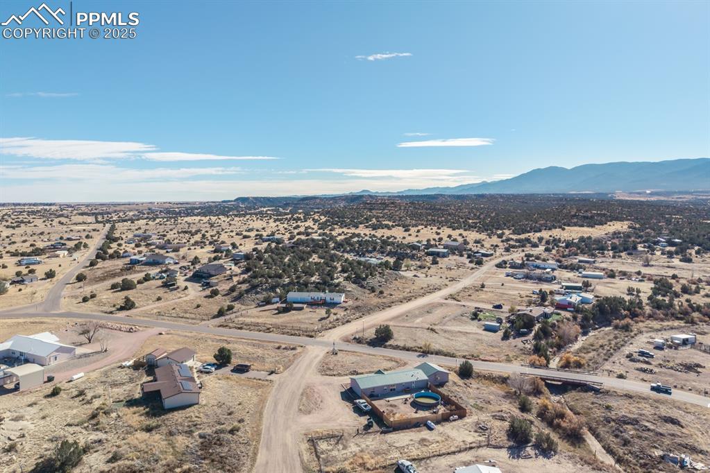 Image 24 of 50: View of rural area featuring a desert landscape and a mountainous backgroun