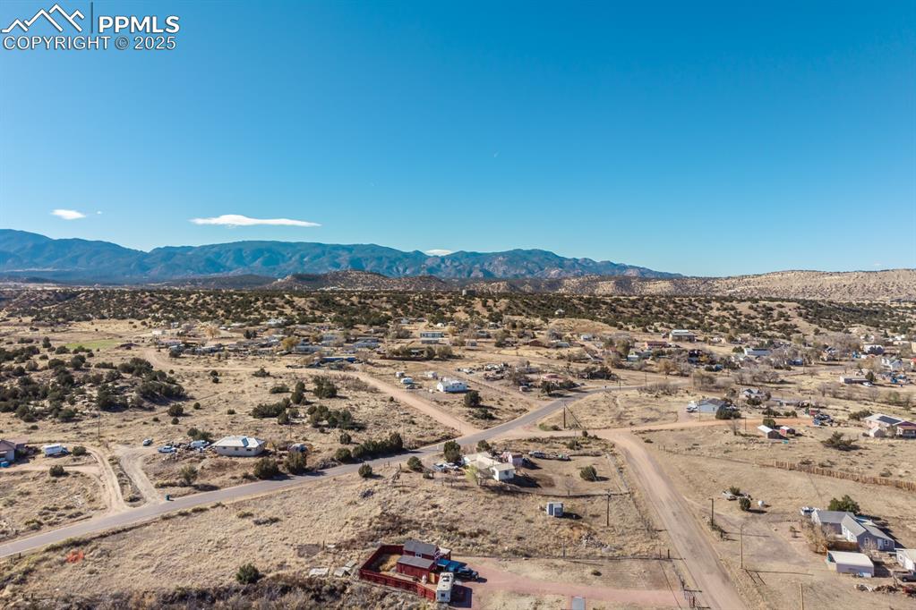 Image 28 of 50: View of rural area featuring a mountain backdrop