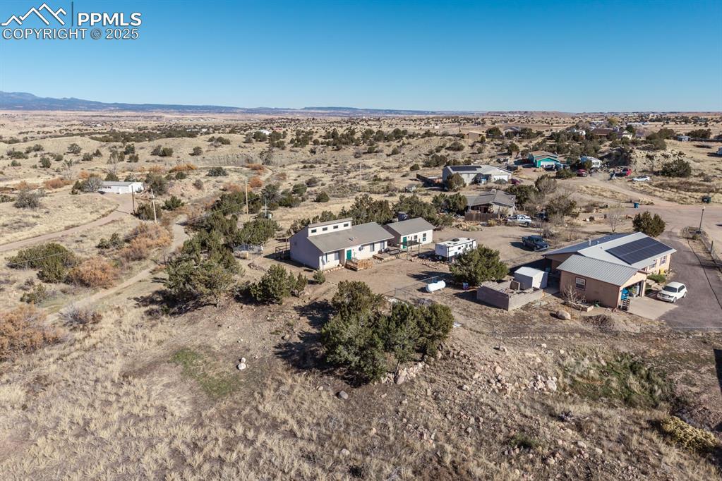 Image 3 of 50: View of rural area featuring a desert landscape and a mountain backdrop