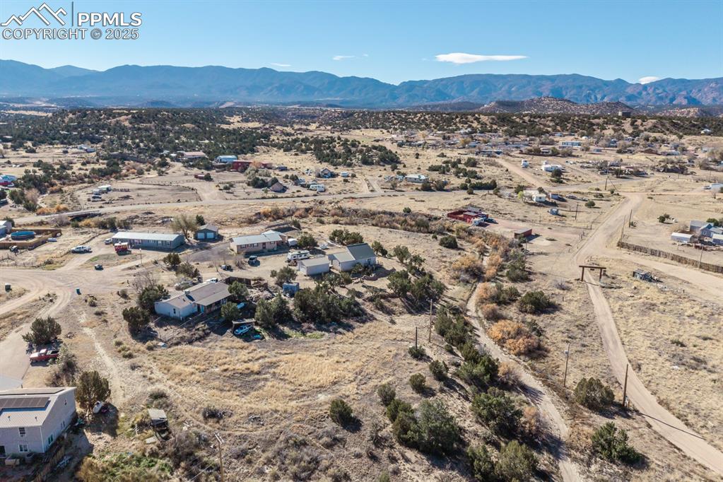 Image 30 of 50: View of rural area with a mountainous background