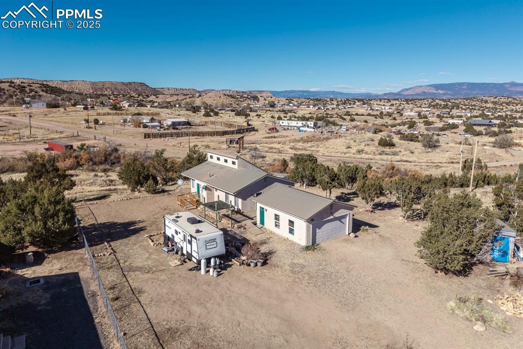 Image 5 of 50: View of rural area featuring a mountain backdrop and a desert landscape
