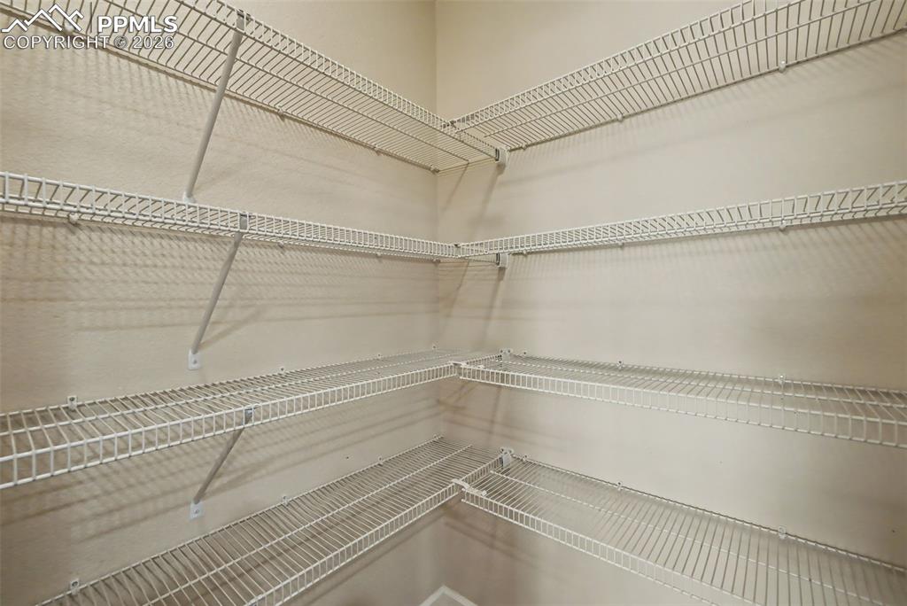 Image 16 of 42: Walk-in kitchen pantry!