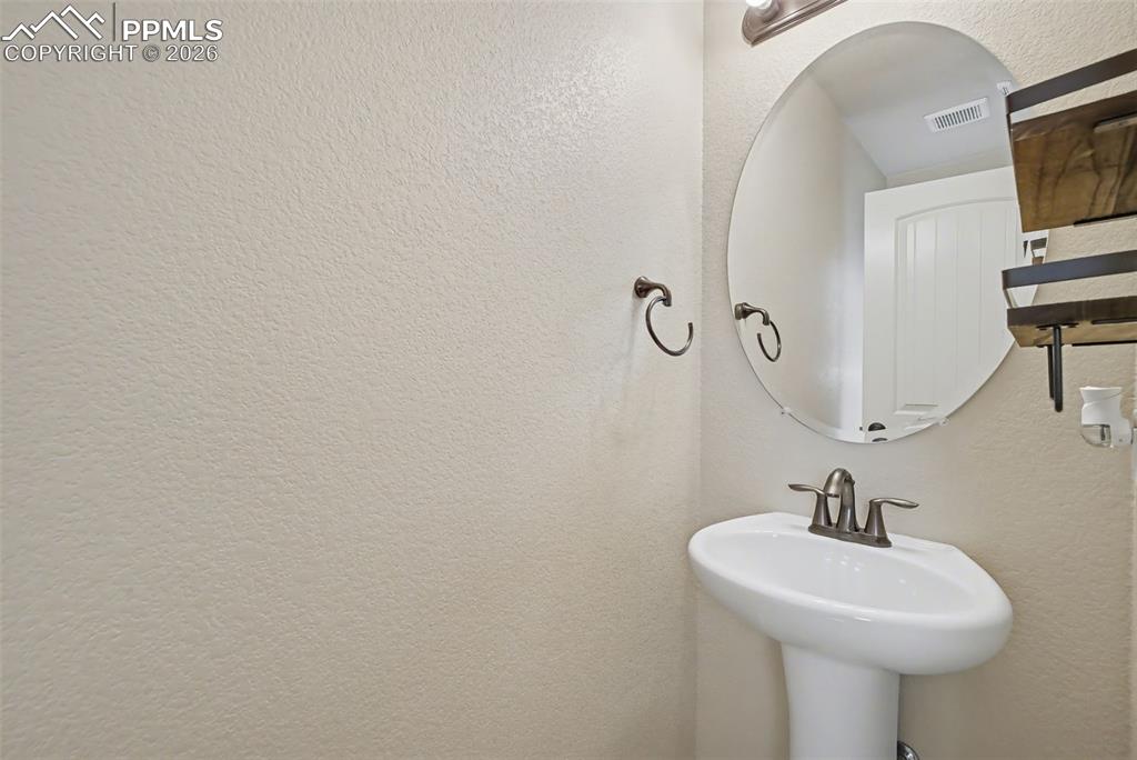 Image 17 of 42: Main level half-bathroom