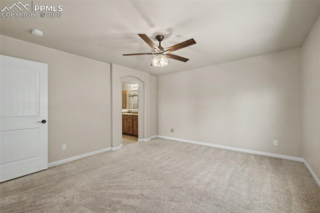 Image 19 of 42: The primary bedroom features an ensuite 5-piece bathroom and walk-in closet