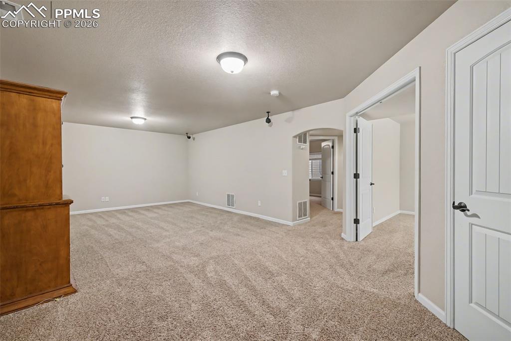Image 27 of 42: A spacious family room is located in the basement!