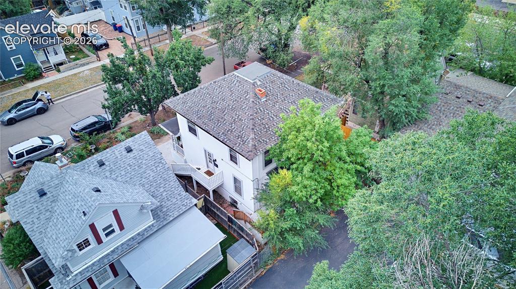 Image 9 of 50: Gabled roofline with asphalt shingles