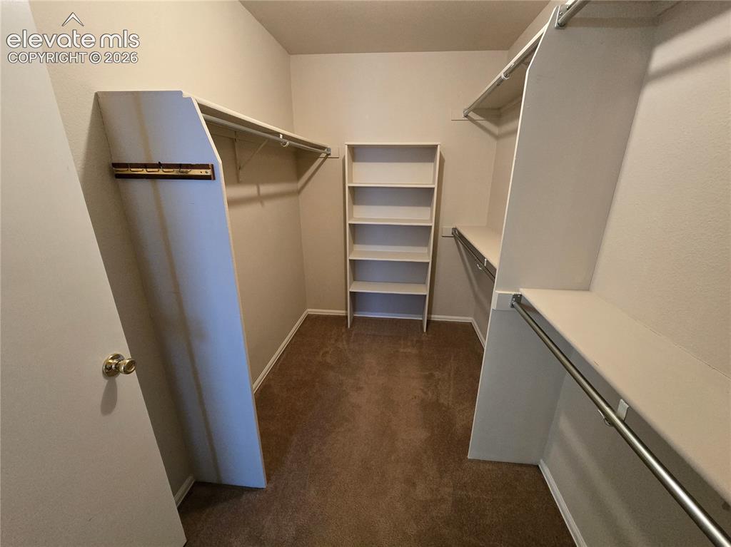 Image 11 of 21: Primary Walk-in Closet