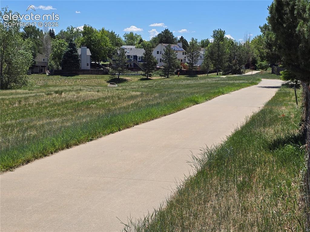 Image 21 of 21: Backs to Walking Trail