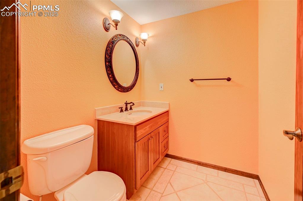Image 14 of 34: Bathroom featuring vanity and tile patterned floors