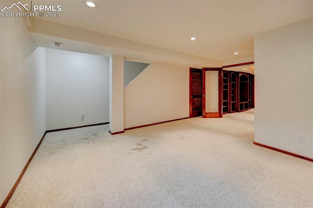 Image 16 of 34: Finished basement featuring recessed lighting and carpet flooring