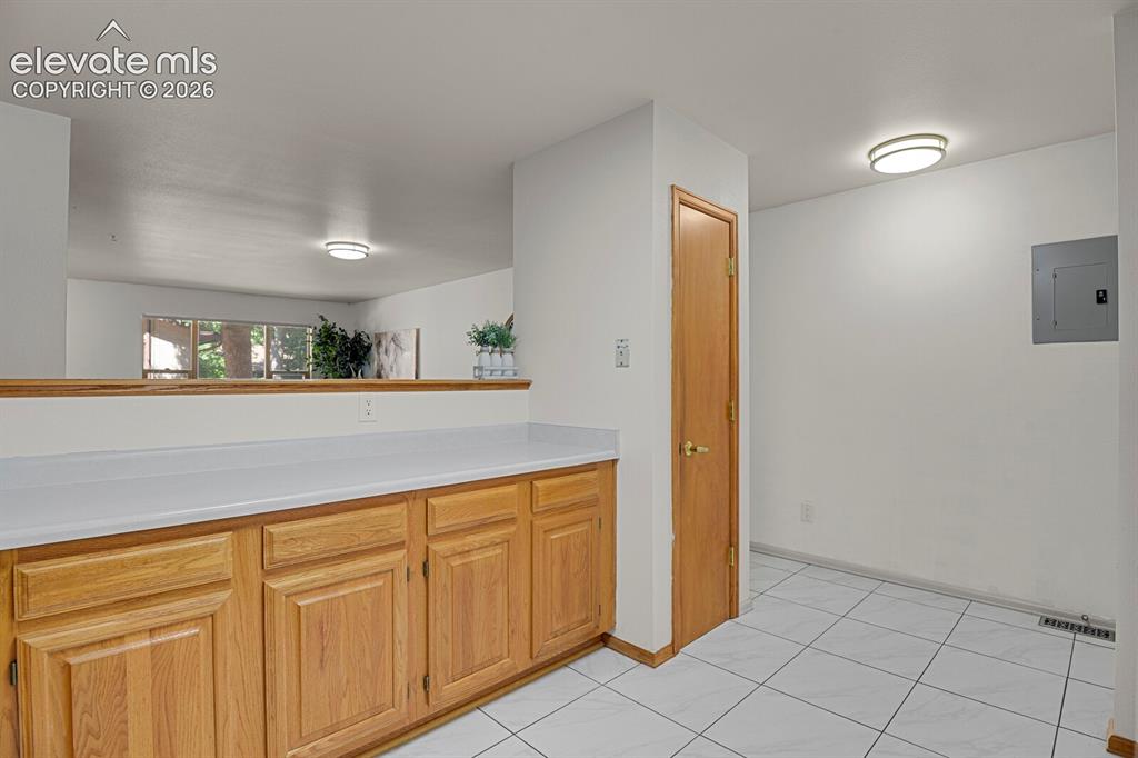 Image 10 of 19: Pantry for extra storage