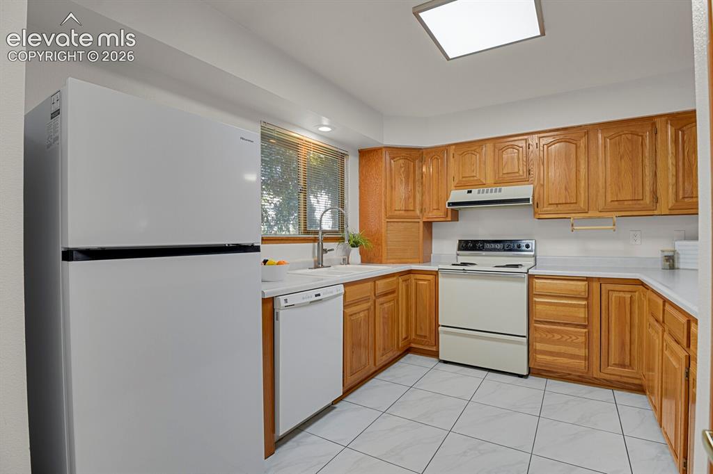Image 8 of 19: Kitchen with new refrigerator