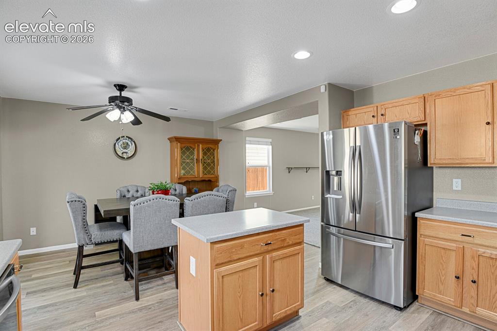 Image 15 of 31: Kitchen featuring wood-finish cabinetry, stainless steel appliances includi