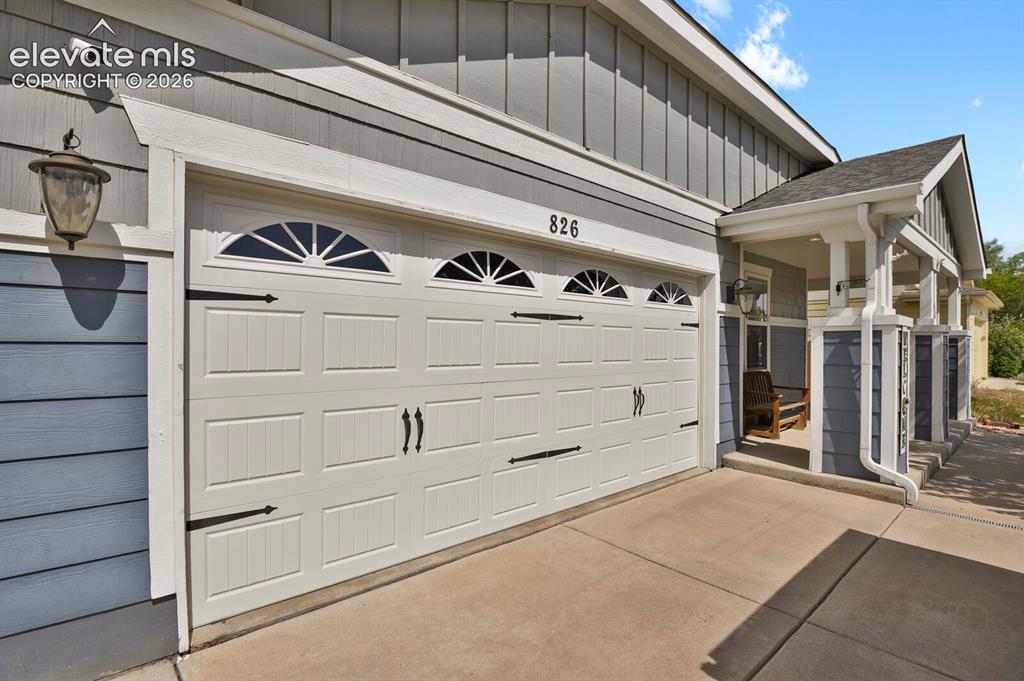 Image 3 of 31: Ranch-style residence featuring a prominent front tree with a brick-lined b