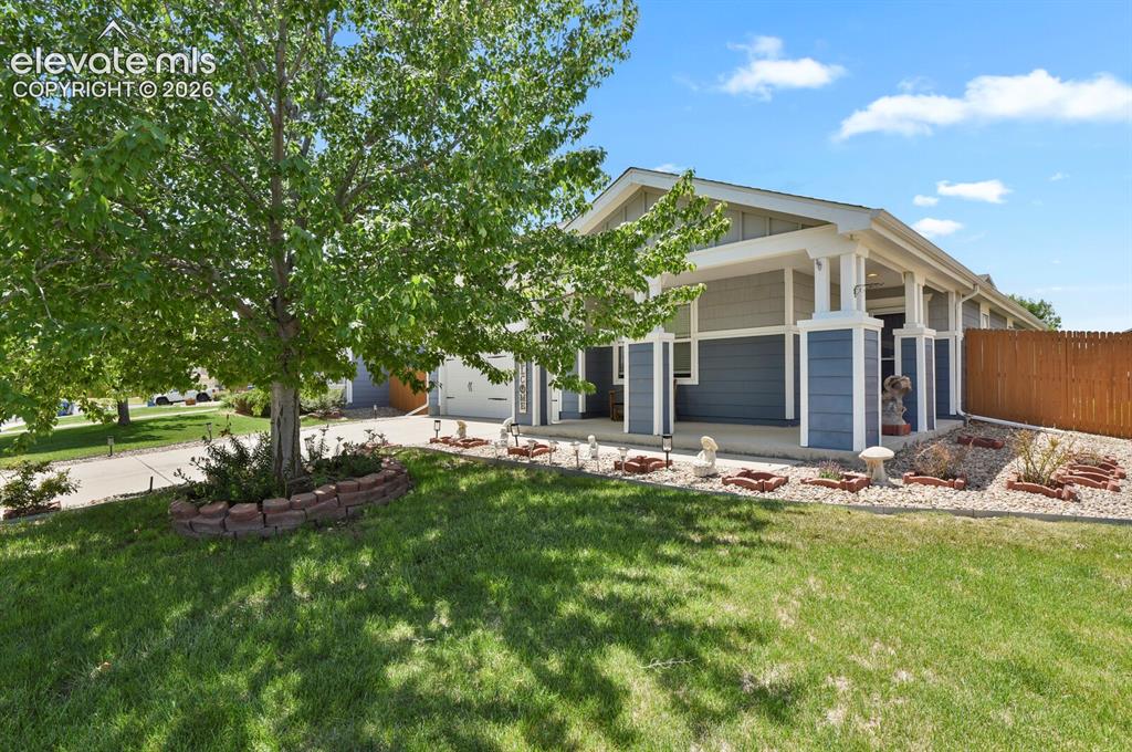 Image 6 of 31: Covered front porch