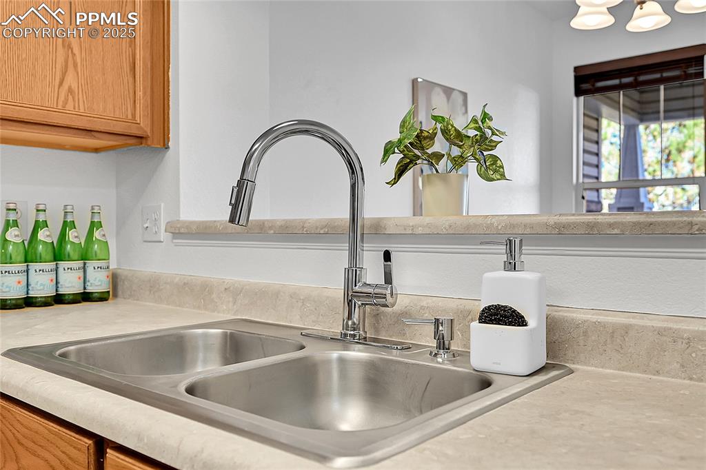 Image 10 of 31: Kitchen view of light countertops and a sink