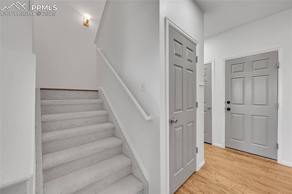 Image 14 of 31: Stairway with wood finished floors
