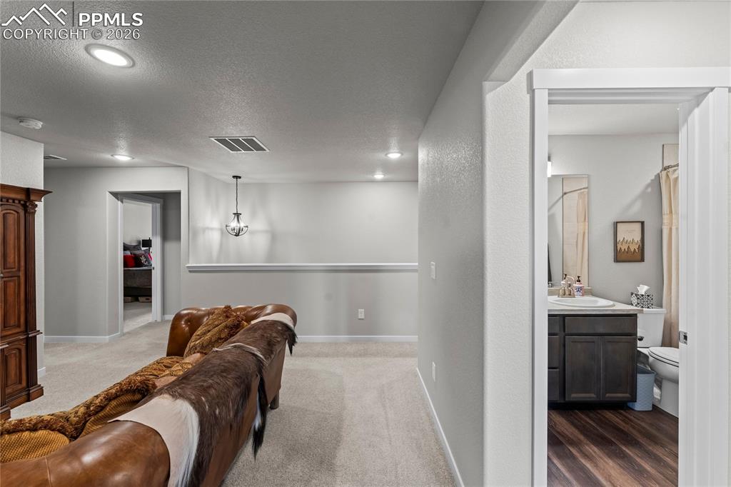 Image 20 of 46: Upstairs loft with full bathroom