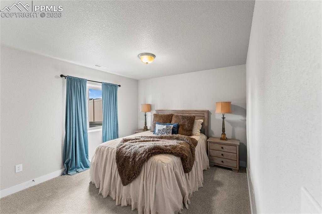 Image 37 of 46: Basement bedroom