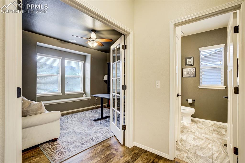 Image 21 of 48: Dedicated office on main level, hardwood flooring