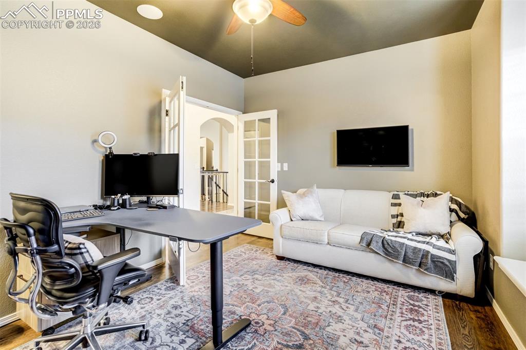 Image 22 of 48: Dedicated office on main level, hardwood floors