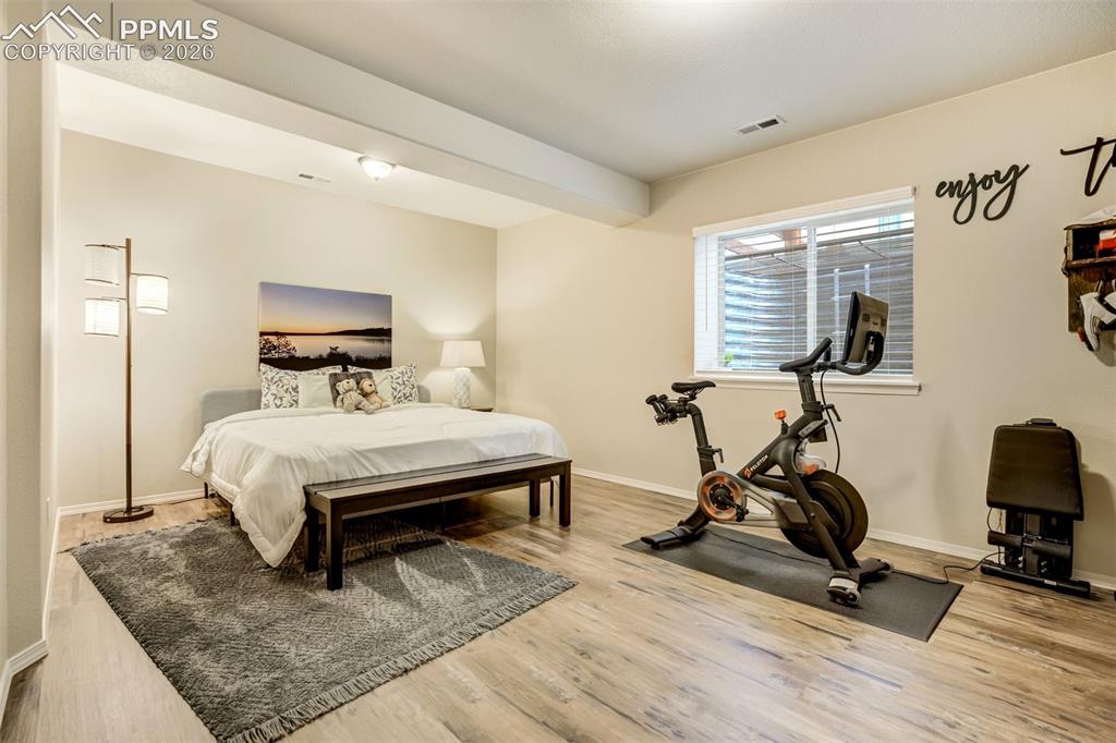 Image 39 of 48: Basement bedroom 3 and Versatile room featuring LVP flooring, a functional
