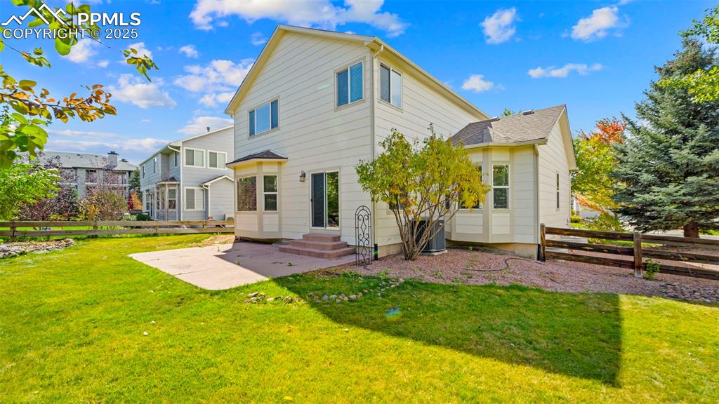 Image 8 of 50: Rear view of property with a patio
