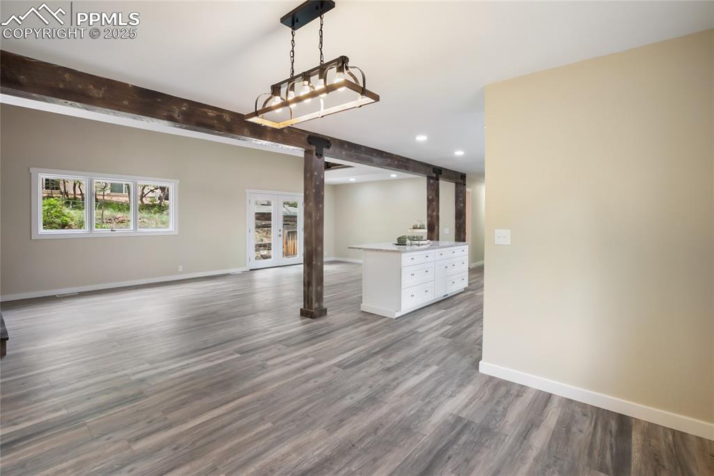 Image 10 of 37: Great room style with kitchen, dining and living space
