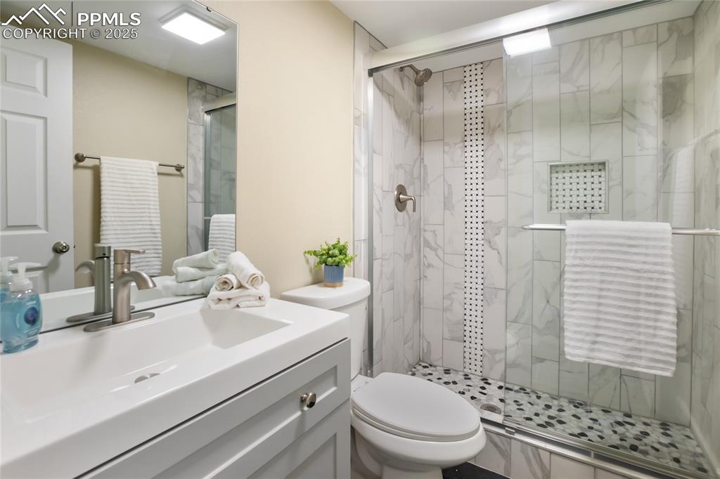 Image 24 of 37: Lower level remodeled bathroom