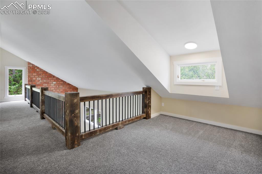 Image 26 of 37: Upper level loft space for bonus area. Great for play, home office, craftin