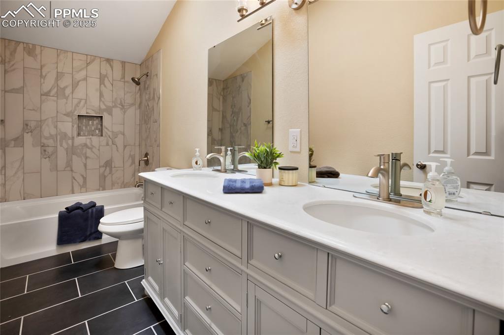 Image 30 of 37: Upper level reimagined full bathroom