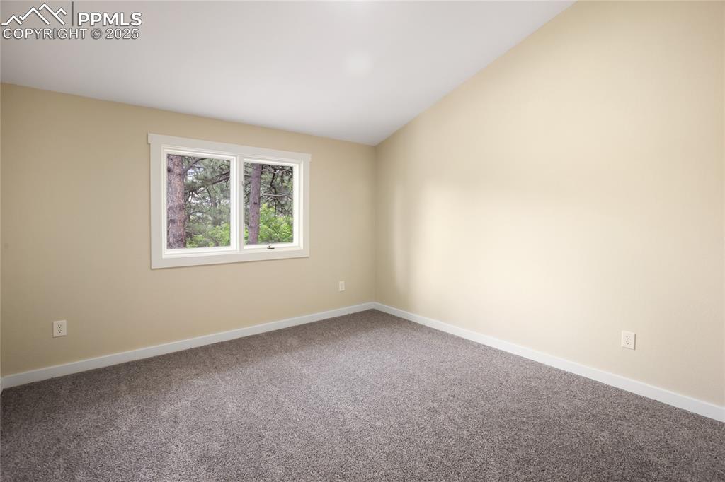 Image 32 of 37: Upper level two of two bedrooms