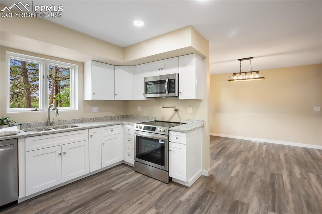Image 9 of 37: Kitchen and dining open concept