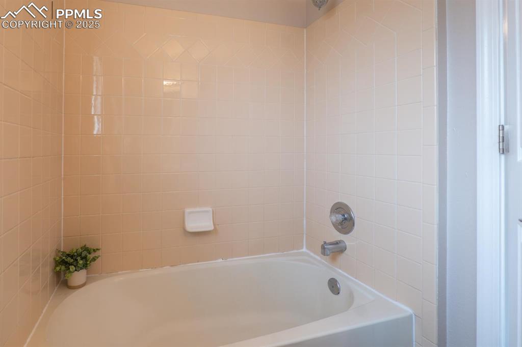 Image 14 of 26: Full primary bathroom.